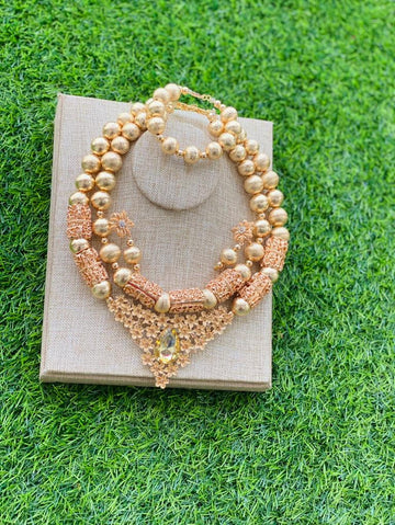 Custom hand-made beige rolled gold beads