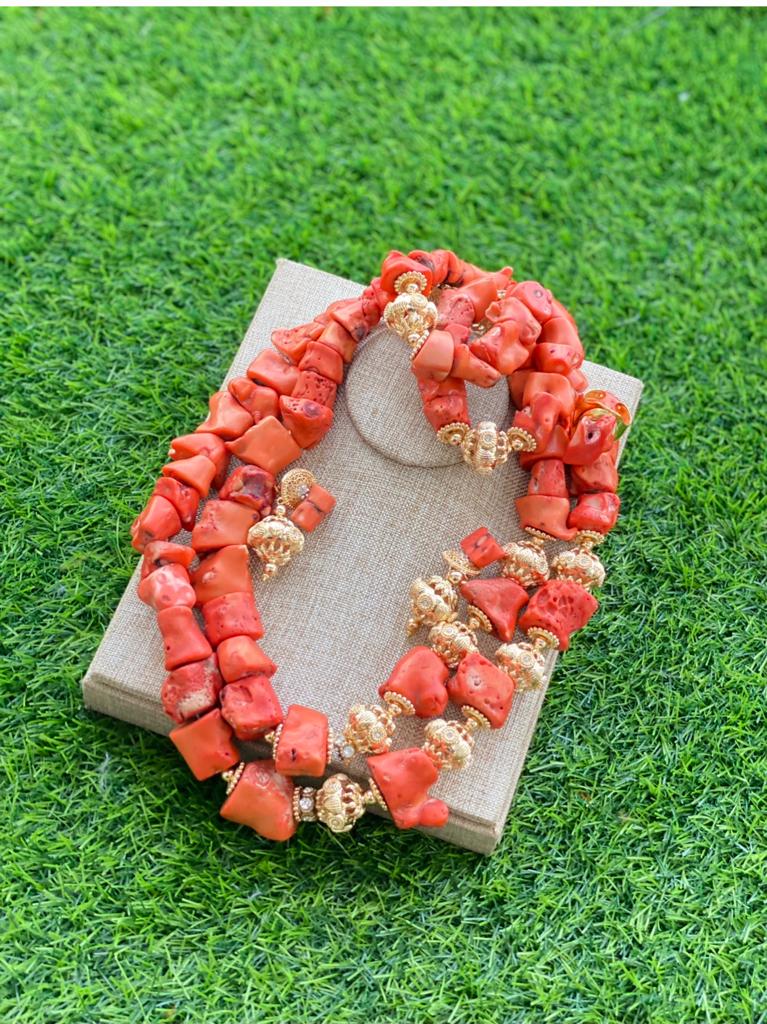 Custom hand-made coral beads with gold inlays