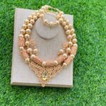 Custom hand-made beige rolled gold beads view 1