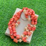 Custom hand-made coral beads with gold inlays view 1